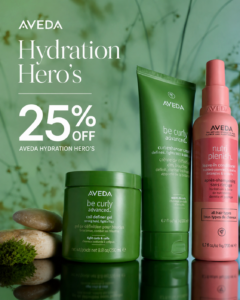 Aveda products including Be Curly Advanced gel, curl cream, and Nutriplenish leave-in conditioner with a 25% off Hydration Hero’s promotion, displayed with green leaves and stones. - The Image Salon & Day Spa, CA